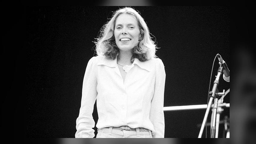 Joni Mitchell performs on stage, supporting Crosby, Stills, Nash and Young at Wembley Stadium, London, 14th September 1974. (Photo by Michael Putland/Getty Images) 